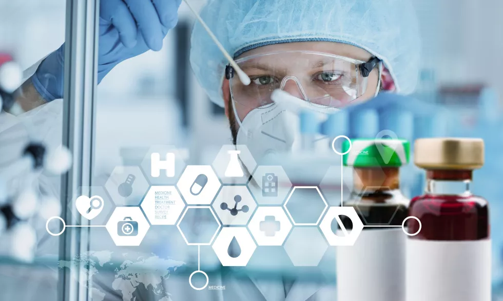 scientist-white-lab-coat-filter-sample-into-vial