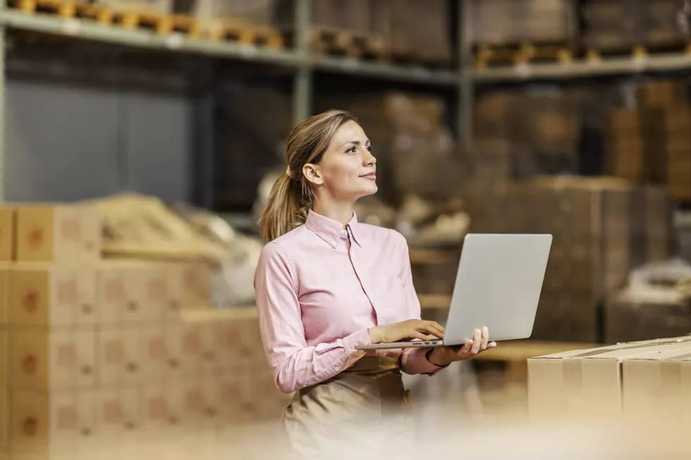 food-industry-worker-checking-shipment-laptop-warehouse