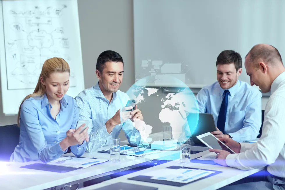 business-people-cooperation-technology-concept-smiling-business-team-with-gadgets-globe-hologram-meeting-office(3)