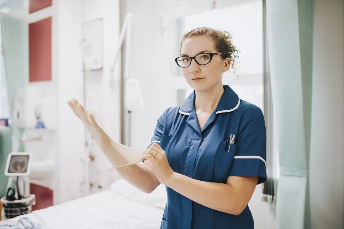 female-nurse-putting-glove